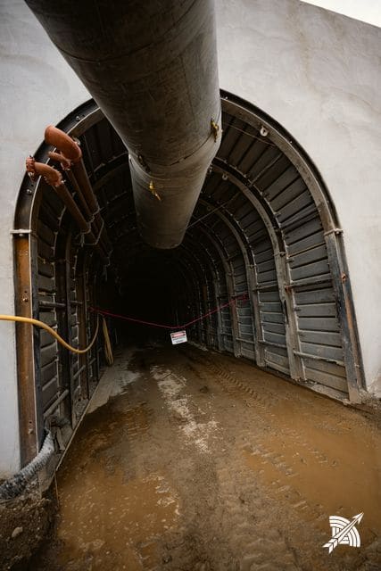 The concrete portal arch head-on, ventilation duct entering above
